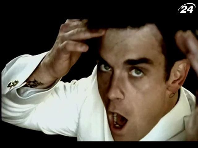 Робби Уильямс шагает к вершине британского хит-парада Робби Уильямс шагает к вершине британского хит-парада